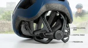 A detailed close-up illustration of the rear micro-adjustment fit system of a premium blue road cycling helmet, highlighting the precision dial, occipital cradle, and adjustable vertical arms.