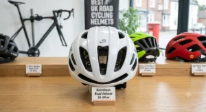 Front view of a sleek, white aerodynamic road cycling helmet under £100 designed for commuting and weekend road races.