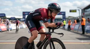 A road cyclist competing in a time trial wearing a tight race-fit short sleeve cycling jersey.