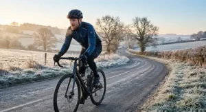A road cyclist wearing a breathable softshell winter cycling jacket on a frosty morning ride.