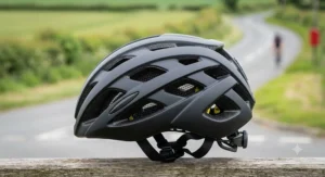 Side profile of a lightweight aerodynamic road cycling helmet under £100 highlighting the extensive ventilation ports for summer riding.