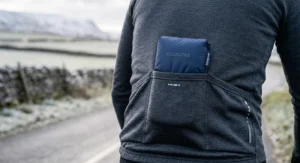 Compact windproof cycling gilet neatly folded to fit inside a rear jersey pocket