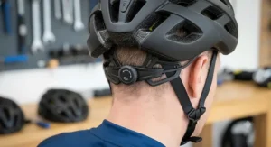 Detailed view of the rear dial-fit adjustment retention system on a road cycling helmet under £100 for a secure and comfortable fit.