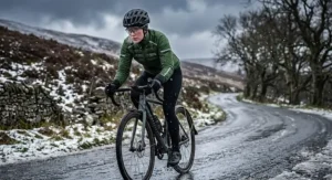 Cyclist in cold UK weather wearing a thermal winter waterproof cycling jacket