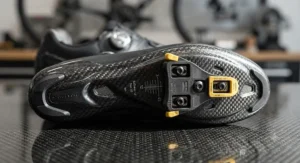Carbon fibre sole detail of the best SPD-SL shoes, highlighting three-bolt road cleat compatibility.