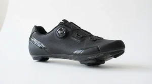 Side profile of budget BOA road shoes showcasing the sleek black upper and dial closure system