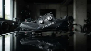 Sleek aerodynamic profile of stiff carbon sole road shoes for racing viewed from the side