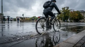 Riding through typical British weather wearing women's road shoes for racing with aerodynamic covers.