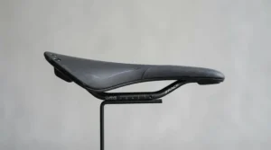 Side profile of a well-padded saddle for numbness cycling designed to enhance perineal comfort